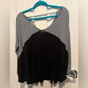 Woman’s shirt . Black with stripes.